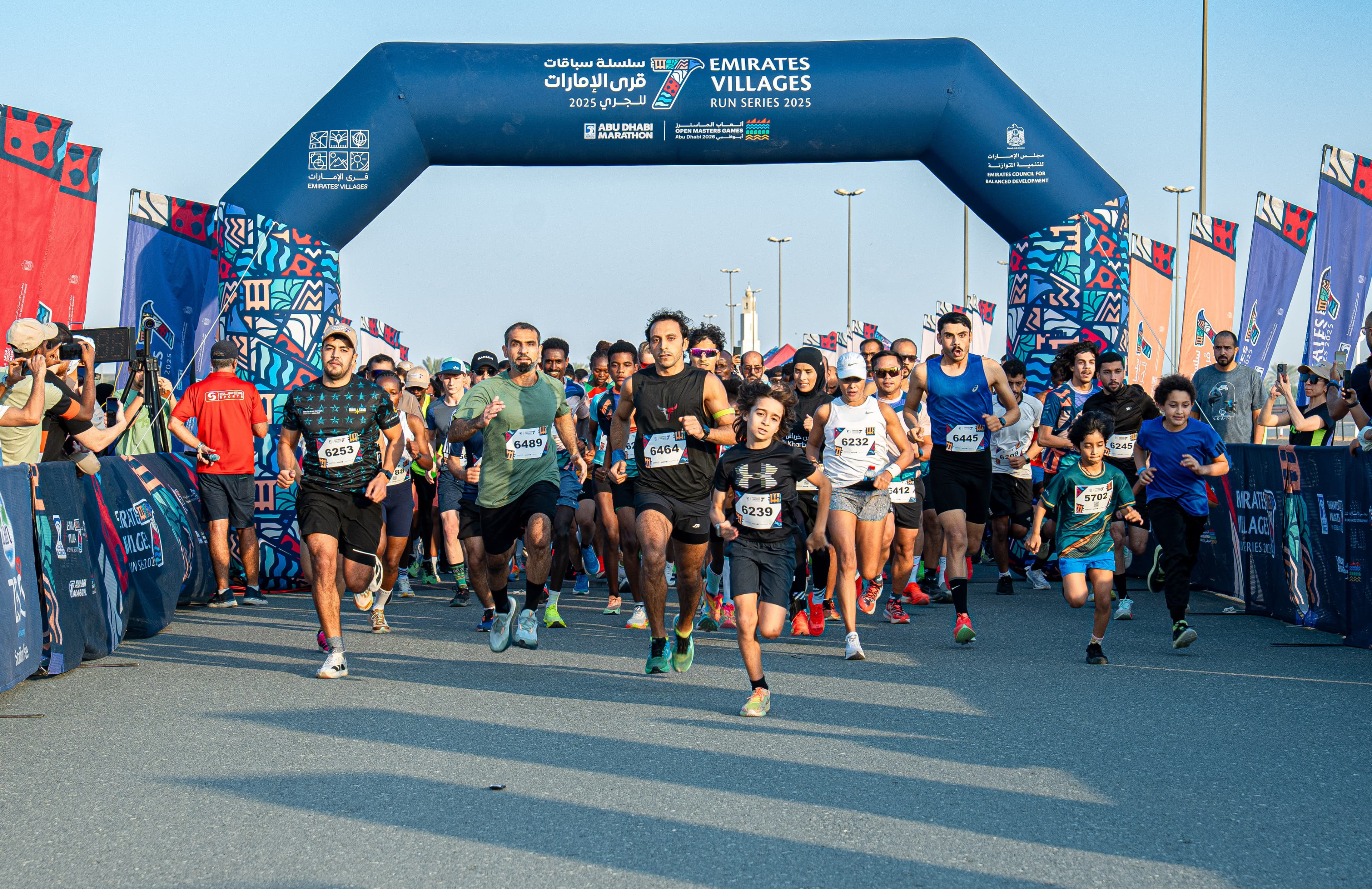 Families and runners at the Emirates Villages start line